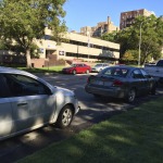 A couple of five cars with smashed windows along our street